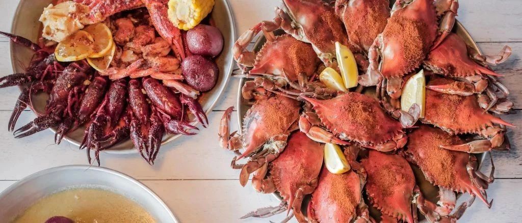 Crab meat fries, snow crab legs and lobster tail with noodles? This newly opened hand-caught seafood in Washington opened the door to my new world!